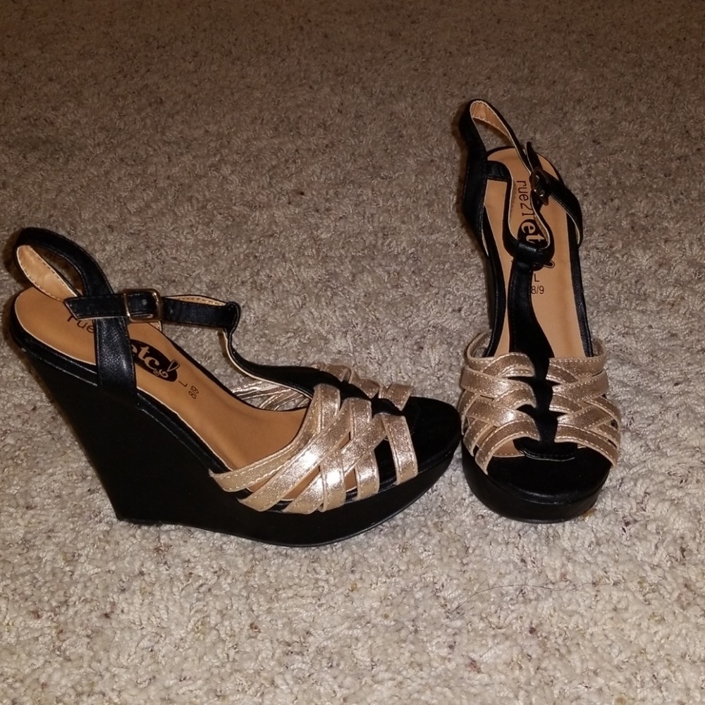Black and gold wedge sandals.